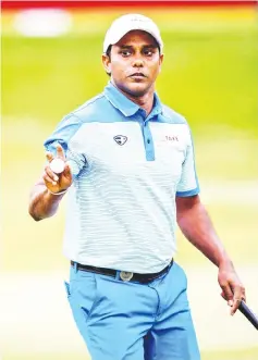 ?? — AFP photo ?? SSP Chawasia of India gestures after a putt during round two of the Hong Kong Open at the Hong Kong Golf Club on November 24, 2017.