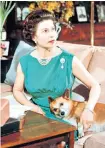  ??  ?? Fixture: the Queen, top, relaxes with the corgis in 1973 and 1969, above. Berry the corgi with England rugby world cup winners in 2003