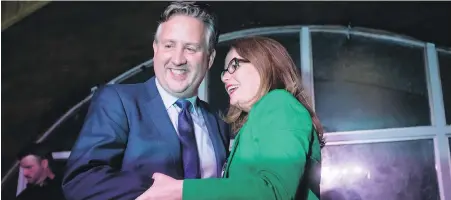  ??  ?? Vancouver mayor-elect Kennedy Stewart, left, celebrates with his wife, Dr. Jeanette Ashe, before addressing supporters in Vancouver early on Oct. 21 after being declared the winner in the tight Oct. 20 election.