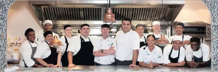  ??  ?? Marine chefs: The kitchen brigade who cook up a storm at Origins.