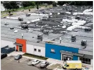  ?? JAROD THRUSH / STAFF ?? Contractor­s are partway through a new roof project at the Montgomery County Job Center, and a system designed to keep water out failed overnight.