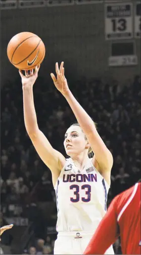  ?? Stephen Dunn / Associated Press ?? UConn’s Katie Lou Samuelson puts up a shot against Louisville on Monday in Storrs.