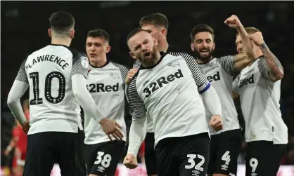  ??  ?? Wayne Rooney celebrates scoring the opening goal from a penalty Photograph: Ross Kinnaird/Getty Images