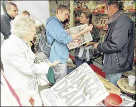  ?? AP fiLe PhoTo ?? People buy Sunday newspapers reporting the death of Diana, Princess of Wales, on Aug. 31, 1997.