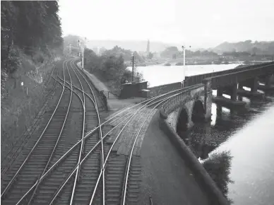  ?? Dr I Scrimgeour/Signalling Record Society/ Kiddermins­ter Railway Museum ?? This is the first of three views, taken on Saturday, 29 July 1939 at Border Counties Junction that record the path of the Newcastle & Carlisle main line and the incoming Allendale and Border Counties lines. In this west-facing scene the single-track ex-NER route from Allendale is seen with its down and up line connection­s – note the slip arrangemen­t at the main line – and in the foreground is the former North British Railway route to Reedsmouth and Riccarton Junction, the Border Counties Railway, which crosses the River Tyne within feet of the box. The Allendale route was by now goods only.