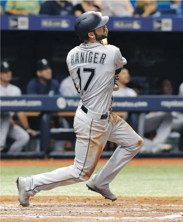  ?? — GETTY IMAGES ?? Seattle Mariners outfielder Mitch Haniger admires his grand slam off Tampa Bay Rays starter Jake Odorizzi Saturday during Seattle’s 7-6 victory at Tropicana Field in St. Petersburg, Fla. Haniger’s eighth homer of the year came after a three-week stint...