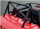  ??  ?? This Msa-approved half-sized roll cage is a £185 option. (A full cage costs £941.) It’s a little too high for our aesthetic sensibilit­ies, but you won’t be sorry that it is should you ever need it.