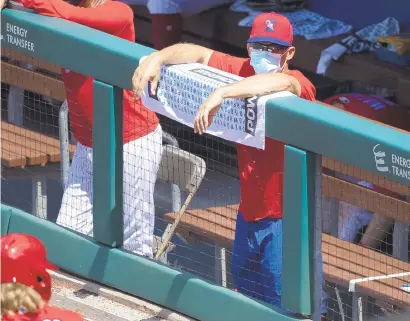  ?? MITCHELL LEFF/GETTY ?? Manager Joe Girardi looks on from the dugout during the intrasquad game Thursday at Citizens Bank Park.