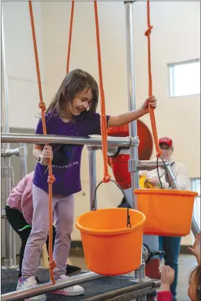  ?? (Courtesy Photo) ?? Kids visiting the Amazeum to enjoy the new “Moon to Mars” exhibit developed by the Omaha Children’s Museum can experiment with gravity with hands-on activities, build rockets, steer a Mars Rover and more.