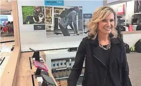  ?? RICK ROMELL / MILWAUKEE JOURNAL SENTINEL ?? Michelle Gass, now CEO of Kohl’s Corp., stands in an Amazon “smart home” shop in Chicago last October. Kohl’s recently expanded its alliance with Amazon, adding 21 southeaste­rn Wisconsin stores to those already processing free returns to the giant online retailer.