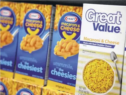  ?? JOHN GRESS ■ REUTERS FILE ?? Walmart private-label store brand Great Value macaroni and cheese is shelved next to Kraft’s at a store in Chicago.