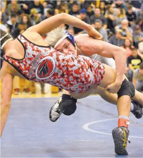  ?? JIM THOMPSON/JOURNAL ?? Cleveland’s Mikey Mascarenas, right, dives into Rio Grande’s Sergio Arellano in their 120-pound match on Saturday. Mascarenas won by pin.