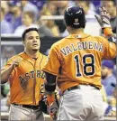  ?? ORLIN
WAGNER / AP ?? The Astros’ Jose Altuve celebrates with Luis Valbuena after scoring in the first inning of Thursday’s Game 1 of the ALDS. The game did not end in time for this edition.