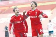  ?? - Afp photo ?? Liverpool’s English defender Trent Alexander-Arnold (right) celebrates scoring his team’s second goal during the English Premier League football match between Liverpool and Aston Villa on Saturday.