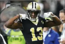  ?? BILL FEIG — THE ASSOCIATED PRESS ?? New Orleans Saints wide receiver Michael Thomas (13) celebrates a run against the Philadelph­ia Eagles in the first half of an NFL divisional playoff football game in New Orleans, Sunday.