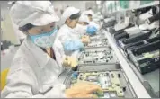  ?? At the Foxconn factory in China’s Shenzhen. FILE ??