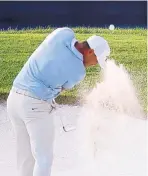  ?? CHARLIE RIEDEL/ASSOCIATED PRESS ?? Brooks Koepka hits out of a bunker on the 18th hole during the third round of the PGA Championsh­ip. He leads by 2 shots.