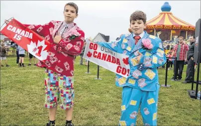  ?? ERIC MCCARTHY/JOURNAL PIONEER ?? Maynard brothers, Jaxon, left, 13, and Dylan, 11, display their O’Leary pride while decked out in Don Cherry suits for the town’s Kraft Hockeyvill­e Winning Weekend outdoor festival Sunday.