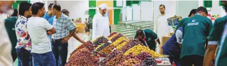  ??  ?? Below: Huzefa said: “While checking out the famous Ajwa dates, I raised my camera and the man at the stall posed for me.”