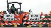  ?? [AP FILE PHOTO] ?? Road constructi­on crews work on a highway in Edinburg, Ill. The Trump administra­tion will soon release its longantici­pated public works plan.