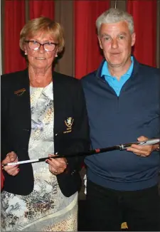  ??  ?? Lady Captain Rita O’Connor presents David Lynch with the winner’s prize in the Lady Captain’s Prize to the Men at Laytown & Bettystown Golf Club.