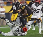  ?? TOM PUSKAR — THE ASSOCIATED PRESS ?? Pittsburgh Steelers running back James Conner runs over Cincinnati Bengals defensive tackle Andrew Billings during the second half of a blowout win Monday night.