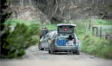  ?? DAVID WALKER/STUFF ?? Police have closed Harrs Rd near where a body was found in the Waimakarir­i River.