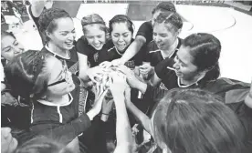  ?? BEN MOFFAT/AZCENTRAL SPORTS ?? The St. Michael girls basketball team celebrates on the court after winning the 1A girls state championsh­ip game at the Prescott Valley Event Center on Saturday.