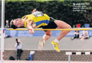  ??  ?? Up and over Tom Chandler goes clear at 1.88m in the high jump