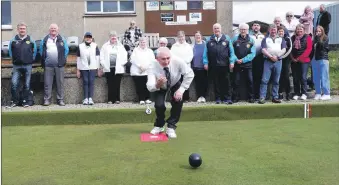  ?? ?? Lochgilphe­ad Bowling Club president Mark Harkness delivers the first bowl of the season.