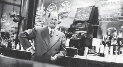  ?? Photos courtesy of Wanda Garner Cash ?? Mayo Bessan stands behind the bar of the Cadillac Bar in Nuevo Laredo. Founded in 1924, the bar was an oasis of gentility that attracted celebritie­s, politician­s, ranchers, tourists and others for more than 50 years.