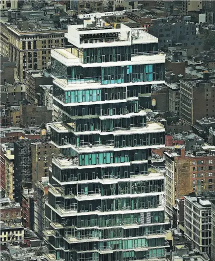  ?? SPENCER PLATT / GETTY IMAGES ?? The luxury residentia­l tower 56 Leonard Street in Manhattan, a borough where home sales have fallen 17 per cent from the previous year and the average sales price fell five per cent to US$2.1 million.