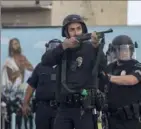  ?? Ringo H.W. Chiu/Associated Press ?? Los Angeles police officers used rubber bullets May 30 during a protest over the death of George Floyd.