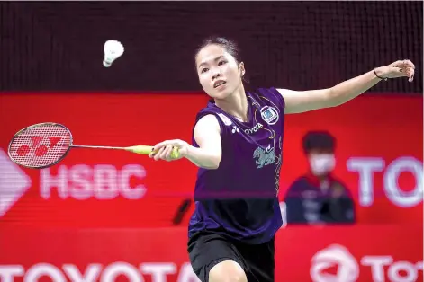  ??  ?? Thailand's Ratchanok Intanon hitting a shot against India's Pusarla V. Sindhu during their women's singles match at the Toyota Thailand Open badminton tournament in Bangkok. - AFP photo