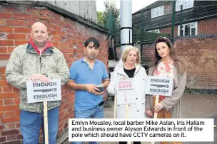  ??  ?? Emlyn Mousley, local barber Mike Aslan, Iris Hallam and business owner Alyson Edwards in front of the pole which should have CCTV cameras on it.