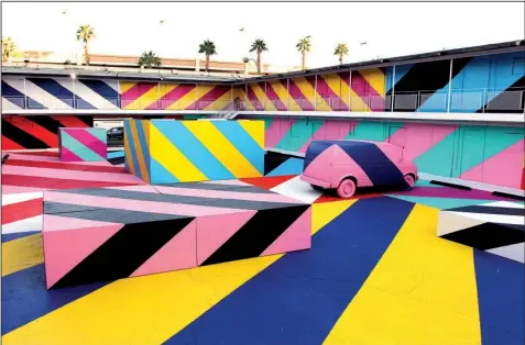  ?? Courtesy of Maser ?? In October, as part of the Life Is Beautiful music and art festival, Maser led a team in completely covering a Las Vegas motel. It took a week of work and more than 50 gallons of paint.