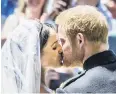  ?? PHOTO: POOL/GETTY IMAGES ?? Sealed with a kiss . . . Prince Harry, Duke of Sussex, and Meghan Markle, Duchess of Sussex, kiss on the steps of St George’s Chapel, Windsor Castle.