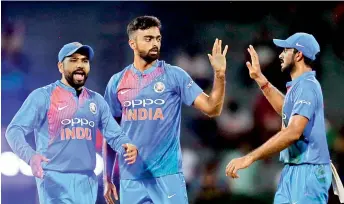 ?? — AP ?? India’s Jaydev Unadkat (centre) celebrates the dismissal of Bangladesh batsman Mehidy Hasan with his teammates during a tri-series T20 match in Colombo on Thursday.