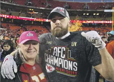  ?? Icon Sportswire/Getty Images ?? TRAVIS KELCE celebrates with his mother, Donna, after a win in the AFC championsh­ip game three seasons ago. Donna Kelce will watch her sons make history next Sunday when they meet in the Super Bowl.