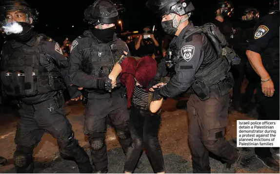  ??  ?? Israeli police officers detain a Palestinia­n demonstrat­or during a protest against the planned evictions of Palestinia­n families