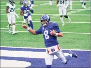  ?? Seth Wenig / Associated Press ?? New York Giants quarterbac­k Daniel Jones rushes for a touchdown during the first half of an NFL game against the Philadelph­ia Eagles on Sunday in East Rutherford, N.J. Jones threw for 244 yards and ran for a touchdown in the Giants’ 27-17 win.