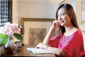  ??  ?? Home owner Mercedes Yao enjoys reading or relaxing in her master bedroom with a corner functionin­g as a study.
