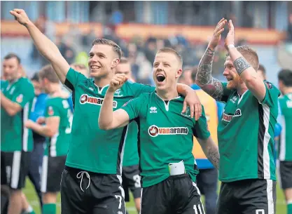  ??  ?? From left, Lincoln’s Alan Power, Terry Hawkridge and Jonathan Jack Muldoon celebrate after beating Burnley.