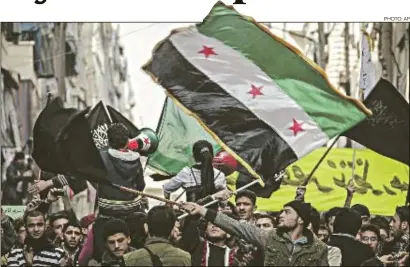  ?? PHOTO: AP ?? Aleppo Syrians demonstrat­ing against President Assad’s regime after Friday prayers in the city last week