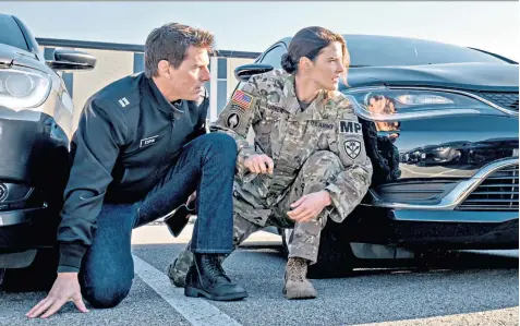  ??  ?? Shoulder to shoulder: Tom Cruise as Reacher with his wingman, Cobie Smulders, in Jack Reacher: Never Go Back