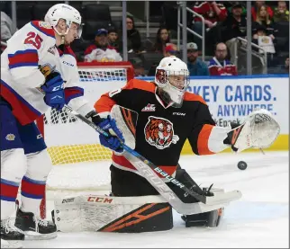  ?? NEWS PHOTO RYAN MCCRACKEN ?? Edmonton Oil Kings winger Andrei Pavlenko attempts to deflect a shot in front of Medicine Hat Tigers goaltender Mads Søgaard during Game 2 of their Western Hockey League’s Eastern Conference quarter-final series on Sunday at Rogers Place. Tigers lost 4-3 on Sunday, but gained a split of the opening two games of the best-of-seven series. Game 3 in the series goes Tuesday at 7 p.m. at the Canalta Centre.