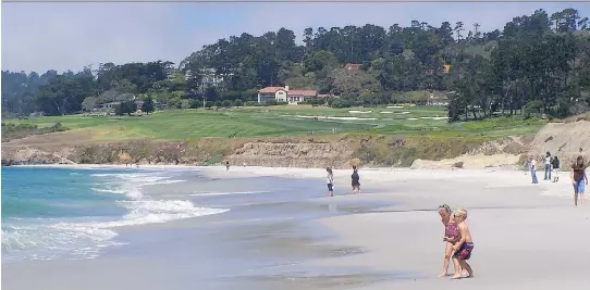  ?? PHOTOS: JIM BYERS FOR POSTMEDIA NEWS ?? Kids and adults (and dogs, too) love the soft, white sand at Carmel Beach. You can watch golfers at Pebble Beach Golf Links while you’re at it.