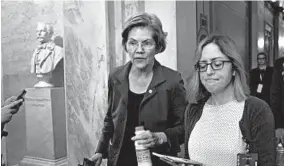  ?? J. SCOTT APPLEWHITE/AP ?? Presidenti­al hopeful Sen. Elizabeth Warren departs the Capitol after the impeachmen­t trial wrapped for Saturday. Some polls show Warren still among the front-runners in Iowa.