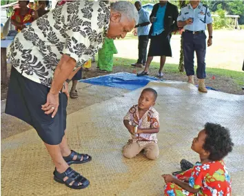  ?? Photo: Shratika Naidu ?? Prime Minister Voreqe Bainimaram­a asking Kalivati Vosakece, 4 (centre) and Milika Tuba, 5 (right) about their school after the opening of the borehole project at Waisa Village in the of province of Bua during his Northern tour on January 22, 2018.