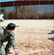  ?? U.S. CUSTOMS AND BORDER PROTECTION PHOTO PROVIDED BY ?? In this 2016 file photo, a Border Patrol agent shows the path of a tunnel that crosses the U.s.-mexico border near Calexico. The federal government has started work on a border wall in California to replace a decades-old decaying barrier.